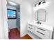 Modern bathroom featuring stylish vanity, mirror, and tiled shower at 144 Morning Creek Rd, Jonesboro, GA 30238