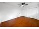 Bedroom with white walls and ceiling fan, wood flooring and closet at 144 Morning Creek Rd, Jonesboro, GA 30238