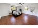 Spacious bedroom showcases wood-look floors and a four-poster bed at 144 Morning Creek Rd, Jonesboro, GA 30238
