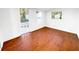 Bright bedroom with wood-look floors, and a glass paneled door to the outside at 144 Morning Creek Rd, Jonesboro, GA 30238