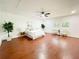 Expansive bedroom with wood-look flooring, bright white walls, and natural light at 144 Morning Creek Rd, Jonesboro, GA 30238