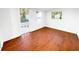 Bright room featuring hardwood style floors, fresh paint, and a view to the backyard at 144 Morning Creek Rd, Jonesboro, GA 30238
