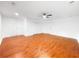 Bonus room featuring wood flooring, white trim, and ceiling fan at 144 Morning Creek Rd, Jonesboro, GA 30238