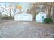 Detached garage with a white door and adjacent small shed at 144 Morning Creek Rd, Jonesboro, GA 30238