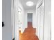 Bright hallway featuring new paint and lighting, leading to bedrooms and bathroom at 144 Morning Creek Rd, Jonesboro, GA 30238