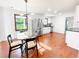 Open kitchen flowing into dining area featuring stainless appliances and island seating at 144 Morning Creek Rd, Jonesboro, GA 30238