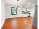 Bright open kitchen with stainless steel appliances and modern light fixture at 144 Morning Creek Rd, Jonesboro, GA 30238