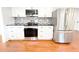 Modern kitchen featuring stainless steel appliances and granite countertops at 144 Morning Creek Rd, Jonesboro, GA 30238