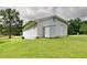 Rear exterior view with vinyl siding, showing the generous yard space at 24 Echo Ridge Dr, Powder Springs, GA 30127