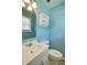 Well-lit bathroom with a vanity, toilet, and shelving at 24 Echo Ridge Dr, Powder Springs, GA 30127
