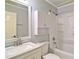 Well-lit bathroom featuring a modern vanity and tub shower at 24 Echo Ridge Dr, Powder Springs, GA 30127