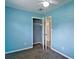 Cozy bedroom featuring a ceiling fan, open closet, and plush carpet at 24 Echo Ridge Dr, Powder Springs, GA 30127