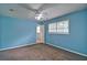 Comfortable bedroom featuring neutral carpet, ceiling fan, and natural light streaming through the windows at 24 Echo Ridge Dr, Powder Springs, GA 30127