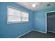 Comfortable bedroom with large window, plush carpet, and closet at 24 Echo Ridge Dr, Powder Springs, GA 30127
