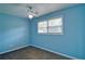 Bedroom with light blue walls, grey carpet and fan with light at 24 Echo Ridge Dr, Powder Springs, GA 30127