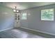 Dining room with modern laminate flooring, built-in corner cabinet, and plenty of natural light at 24 Echo Ridge Dr, Powder Springs, GA 30127