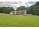 Spacious yard with a well-maintained home featuring both brick and vinyl siding at 24 Echo Ridge Dr, Powder Springs, GA 30127