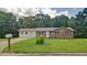Quaint home with a well-kept lawn, charming curb appeal, and a mailbox out front at 24 Echo Ridge Dr, Powder Springs, GA 30127