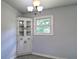 Eat-in kitchen area includes a storage cabinet with glass doors and natural lighting at 24 Echo Ridge Dr, Powder Springs, GA 30127