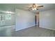 Bright living space with ceiling fan and hardwood floors, offering a view into the dining area at 24 Echo Ridge Dr, Powder Springs, GA 30127