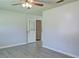 Open-concept living area with a ceiling fan and neutral paint tones at 24 Echo Ridge Dr, Powder Springs, GA 30127