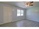Neutral-colored living room with hardwood floors, ceiling fan, and natural light at 24 Echo Ridge Dr, Powder Springs, GA 30127