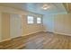 Spacious living room featuring wood-look flooring, two doors and two windows at 24 Echo Ridge Dr, Powder Springs, GA 30127