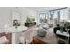 Bright living room with modern furniture, hardwood floors, and floor-to-ceiling windows showcasing city views at 3325 Piedmont Ne Rd # 1708, Atlanta, GA 30305
