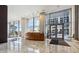 Modern building lobby with marble floors, a wood reception desk, and a floor to ceiling glass windows at 3325 Piedmont Ne Rd # 1708, Atlanta, GA 30305