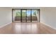 Bright sunroom with floor-to-ceiling sliding doors and hardwood floors at 3530 Piedmont Ne Rd # K8, Atlanta, GA 30305