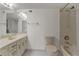 Bright bathroom featuring a modern vanity, a well-maintained toilet, and a shower-tub combination at 3530 Piedmont Ne Rd # K8, Atlanta, GA 30305
