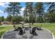 Outdoor fire pit area with seating perfect for entertaining on a beautiful and well maintained property at 3530 Piedmont Ne Rd # K8, Atlanta, GA 30305