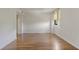 Open living room featuring hardwood floors and a bright window, creating a welcoming and airy space at 3530 Piedmont Ne Rd # K8, Atlanta, GA 30305