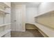 Organized walk-in closet with built-in shelving, offering ample storage space and convenience at 3530 Piedmont Ne Rd # K8, Atlanta, GA 30305