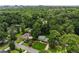 Overhead image showcases the house with pool surrounded by beautiful, mature trees at 4984 Wickford Way, Atlanta, GA 30338