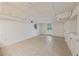 Finished basement featuring tile flooring, neutral paint, and access to the backyard at 4984 Wickford Way, Atlanta, GA 30338