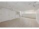 Finished basement featuring tile flooring, neutral paint, and ample storage at 4984 Wickford Way, Atlanta, GA 30338