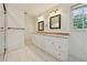 Bathroom with dual vanity, granite countertops, and tiled floor and shower at 4984 Wickford Way, Atlanta, GA 30338