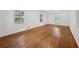 Spacious bedroom with hardwood floors and three windows at 4984 Wickford Way, Atlanta, GA 30338