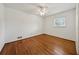 This bedroom has hardwood floors, natural light, and a ceiling fan at 4984 Wickford Way, Atlanta, GA 30338