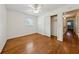Bedroom with hardwood floors, a ceiling fan, and a closet, perfect for storage at 4984 Wickford Way, Atlanta, GA 30338