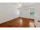 Bedroom featuring hardwood floors, a ceiling fan and two windows at 4984 Wickford Way, Atlanta, GA 30338