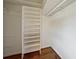 Walk-in closet with hardwood floors and custom shelves at 4984 Wickford Way, Atlanta, GA 30338