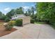 Exterior view of home featuring a side-entry garage, and lush landscaping at 4984 Wickford Way, Atlanta, GA 30338