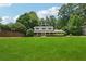 Charming two-story home features a well-manicured lawn, and mature trees at 4984 Wickford Way, Atlanta, GA 30338