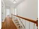 Hallway with hardwood floors, white trim, and natural light at 4984 Wickford Way, Atlanta, GA 30338