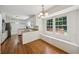 Bright eat-in kitchen with white cabinets, granite countertops, and stainless appliances at 4984 Wickford Way, Atlanta, GA 30338