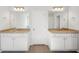 Bright bathroom with double vanity sinks and granite countertops at 11847 Rizvan Pl, Covington, GA 30014