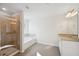 Clean bathroom boasts a glass shower, separate tub, and neutral color palette at 11847 Rizvan Pl, Covington, GA 30014