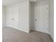 Bedroom featuring neutral carpet, light grey paint, and closet with bi-fold doors at 11847 Rizvan Pl, Covington, GA 30014